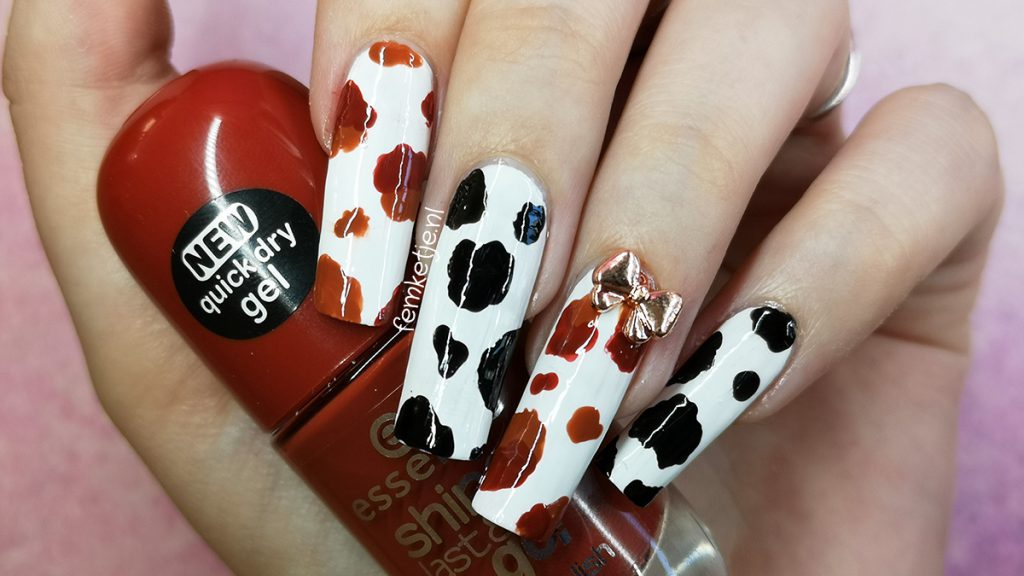 10. Cow Print Nail Design with Glitter Accents - wide 4